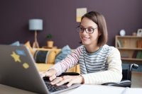 young woman on her laptop